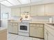 Efficient kitchen featuring modern appliances, ample storage, and a clean, well-maintained space at 4355 Longmeadow # 23, Sarasota, FL 34235