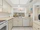 Bright kitchen with a modern sink and faucet, flowing into an open layout at 4355 Longmeadow # 23, Sarasota, FL 34235
