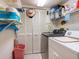 Organized laundry room with shelves and washer/dryer at 4355 Longmeadow # 23, Sarasota, FL 34235