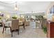 Sunlit living room with tile floors, stylish furnishings, and serene views at 4355 Longmeadow # 23, Sarasota, FL 34235