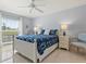 This main bedroom features a plush queen-sized bed, stylish nightstands, and a serene color palette at 4355 Longmeadow # 23, Sarasota, FL 34235