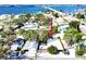 Charming waterfront cottage with mature trees, offering convenient access to the bridge and a serene coastal living experience at 4408 125Th W St, Cortez, FL 34215