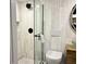Stylish bathroom featuring a modern glass-enclosed shower, toilet, and vanity at 4408 125Th W St, Cortez, FL 34215