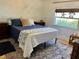 Charming bedroom featuring natural light, coastal decor, and cozy furnishings at 4408 125Th W St, Cortez, FL 34215