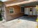 The carport has durable concrete flooring, a covered roof, and convenient access to the main house at 4408 125Th W St, Cortez, FL 34215