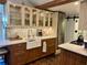 Stylish kitchen featuring custom cabinets, farmhouse sink, stainless steel appliances, and decorative backsplash at 4408 125Th W St, Cortez, FL 34215