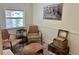 Relaxing sitting area featuring comfortable wicker seating, a side table, and decorative accents at 4408 125Th W St, Cortez, FL 34215