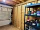 Unfinished storage room with wood walls, a window, storage shelving, and basic utilities at 4408 125Th W St, Cortez, FL 34215