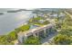 Aerial view of waterfront condo community featuring beautiful water views and mature landscaping at 4500 Gulf Of Mexico Dr # Ph4, Longboat Key, FL 34228