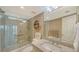 Bright bathroom featuring a glass shower, showerhead, and granite countertop sink at 4500 Gulf Of Mexico Dr # Ph4, Longboat Key, FL 34228