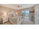 Comfortable bedroom with a plush bed, ensuite bath, and sliding glass doors leading to a balcony at 4500 Gulf Of Mexico Dr # Ph4, Longboat Key, FL 34228