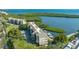 Condominium complex situated alongside a tranquil waterway with boat docks at 4500 Gulf Of Mexico Dr # Ph4, Longboat Key, FL 34228