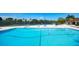 Community pool with lounge chairs, mature landscaping and bright sunny skies at 4500 Gulf Of Mexico Dr # Ph4, Longboat Key, FL 34228