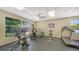 Bright fitness center with exercise equipment and large windows offering outdoor views, creating a pleasant workout environment at 4500 Gulf Of Mexico Dr # Ph4, Longboat Key, FL 34228