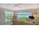 Living room offers breathtaking waterfront views through expansive windows at 4500 Gulf Of Mexico Dr # Ph4, Longboat Key, FL 34228