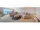 Spacious living room featuring comfortable sectional sofa and scenic water view at 4500 Gulf Of Mexico Dr # Ph4, Longboat Key, FL 34228