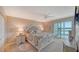 Inviting main bedroom with a plush bed, ensuite bath, and sliding glass doors leading to a balcony at 4500 Gulf Of Mexico Dr # Ph4, Longboat Key, FL 34228