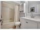 Functional bathroom showcasing a tiled shower, a toilet, and a vanity with a sink at 4722 Oak Hill Ln # 44, Sarasota, FL 34232