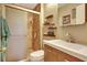 Cozy bathroom featuring a tiled shower with glass door and vanity with solid surface top at 4722 Oak Hill Ln # 44, Sarasota, FL 34232