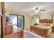 Bright bedroom features stylish furnishings and a sliding door leading outside at 4722 Oak Hill Ln # 44, Sarasota, FL 34232