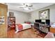 Cozy bedroom with ceiling fan, wood floors, and desk area perfect for work or study at 4722 Oak Hill Ln # 44, Sarasota, FL 34232