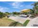 Relax in the outdoor seating area with a view of the serene lake and fountain at 4722 Oak Hill Ln # 44, Sarasota, FL 34232