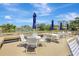 Enjoy community amenities such as tables with umbrellas near the lake with water feature at 4722 Oak Hill Ln # 44, Sarasota, FL 34232