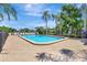 Spend summer days lounging by the community pool, surrounded by lush landscaping and tranquil water views at 4722 Oak Hill Ln # 44, Sarasota, FL 34232