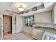 Bright kitchen featuring ample storage space, modern countertops, and tile flooring at 4722 Oak Hill Ln # 44, Sarasota, FL 34232