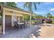 Community patio with a covered area and outdoor seating on a sunny day at 4722 Oak Hill Ln # 44, Sarasota, FL 34232