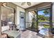 Cozy screened porch with tile flooring, seating, and view of the outdoors at 4722 Oak Hill Ln # 44, Sarasota, FL 34232