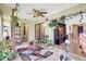 Relaxing sunroom featuring tropical greenery, exercise equipment, and access to other areas of the home at 4722 Oak Hill Ln # 44, Sarasota, FL 34232