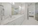 Bathroom with dual sinks, a large vanity, and a view of the walk-in shower at 4726 Zeno Ct, Bradenton, FL 34211