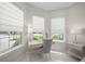 Charming bedroom office area featuring a modern desk, chair, and natural lighting at 4726 Zeno Ct, Bradenton, FL 34211