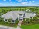 Stunning aerial view of the clubhouse, showcasing its meticulous landscaping and inviting entrance at 4726 Zeno Ct, Bradenton, FL 34211