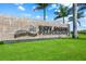 Well-maintained entrance sign for Esplanade at Azario Lakewood Ranch in manicured landscaping and palm trees at 4726 Zeno Ct, Bradenton, FL 34211