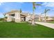 Stunning front exterior showcasing meticulous landscaping and porte cochere entrance at 4726 Zeno Ct, Bradenton, FL 34211