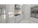 Clean kitchen with stainless steel appliances, white cabinets, and gas stovetop on an island at 4726 Zeno Ct, Bradenton, FL 34211