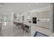 Stylish, bright kitchen with a large island, modern appliances, and sleek cabinetry at 4726 Zeno Ct, Bradenton, FL 34211
