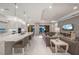 The kitchen opens to the living room, with neutral decor, offering seamless indoor and outdoor entertaining options at 4726 Zeno Ct, Bradenton, FL 34211
