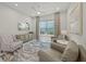 Cozy living room with neutral paint, a decorative rug, and bright, natural light at 4726 Zeno Ct, Bradenton, FL 34211