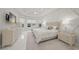 Bright main bedroom features a tray ceiling, custom wall design, and many windows at 4726 Zeno Ct, Bradenton, FL 34211