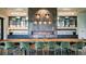 Beautifully decorated meeting room with fireplace, shelving, modern lighting, and large wood conference table at 4726 Zeno Ct, Bradenton, FL 34211