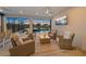 Covered patio with a ceiling fan and multiple seating areas, overlooking the pool at 4726 Zeno Ct, Bradenton, FL 34211