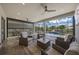 Covered patio with multiple seating areas, overlooking the pool and landscaping at 4726 Zeno Ct, Bradenton, FL 34211