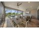 Covered patio with outdoor dining and seating, overlooking the screened-in pool at 4726 Zeno Ct, Bradenton, FL 34211