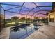 Screened pool area with a water view, perfect for relaxing and entertaining at 4726 Zeno Ct, Bradenton, FL 34211