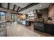 Commercial restaurant kitchen showing pizza oven and stainless steel equipment at 4726 Zeno Ct, Bradenton, FL 34211