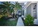 Charming home entrance with lush landscaping and a welcoming walkway to the front door at 5011 100Th E Dr, Parrish, FL 34219