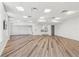 Spacious flex room featuring modern flooring, ample lighting, and a convenient kitchenette at 516 Tamiami S Trl # 102, Nokomis, FL 34275